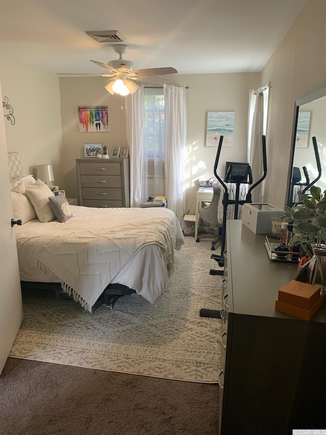 carpeted bedroom with ceiling fan