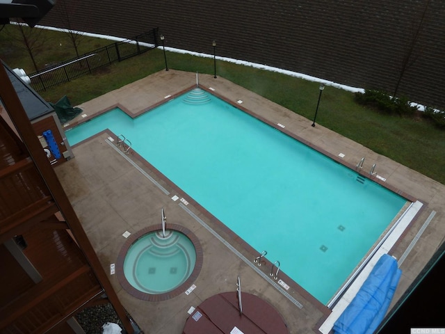 view of pool with a community hot tub and a patio