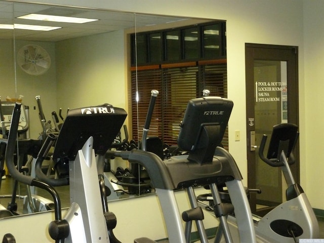 workout area featuring a drop ceiling