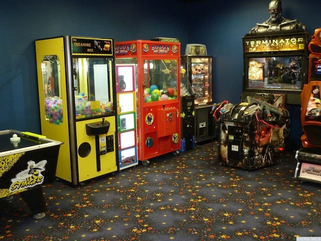 recreation room featuring dark carpet