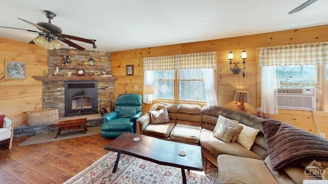 living room with hardwood / wood-style floors, cooling unit, and wooden walls