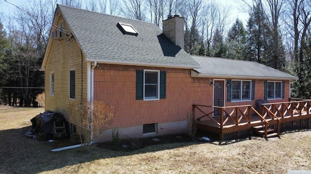 rear view of house with a wooden deck