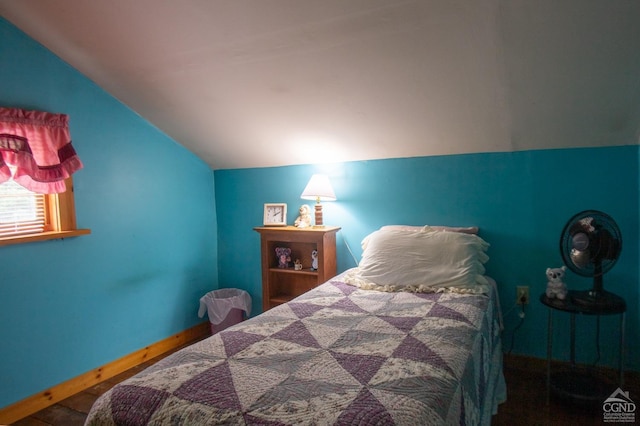 bedroom with wood-type flooring and lofted ceiling