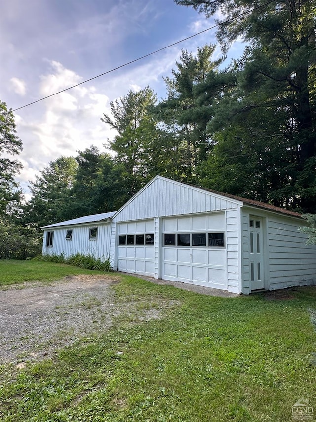 garage featuring a yard