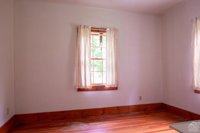 empty room featuring hardwood / wood-style flooring