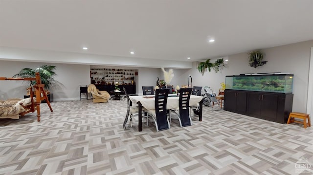 dining space featuring light parquet floors