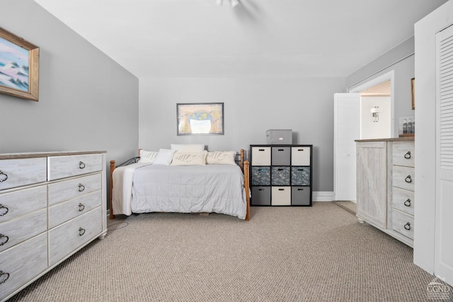 bedroom with light colored carpet