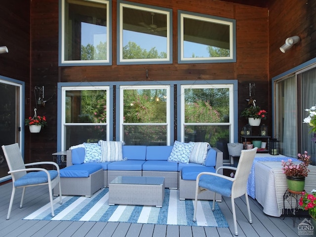 wooden terrace featuring an outdoor living space