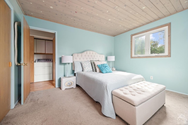 carpeted bedroom featuring washer / clothes dryer and wood ceiling