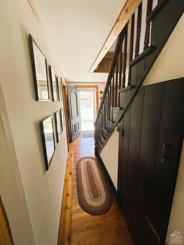 corridor with light hardwood / wood-style flooring