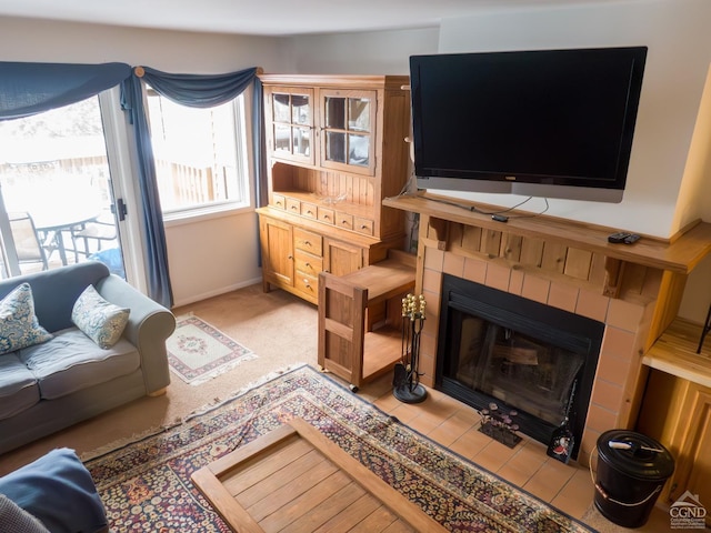 tiled living room with a tile fireplace