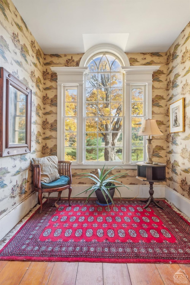 living area with hardwood / wood-style floors and plenty of natural light