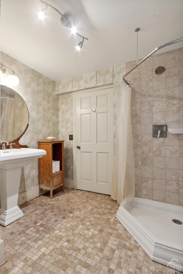 bathroom with sink and a shower with shower curtain