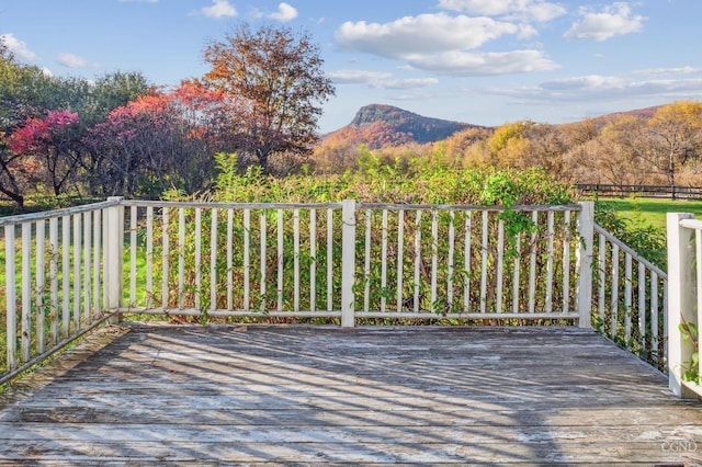 wooden deck featuring a mountain view