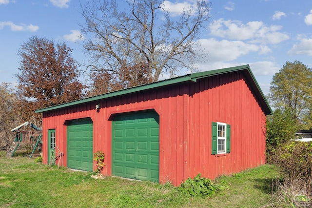 garage with a yard