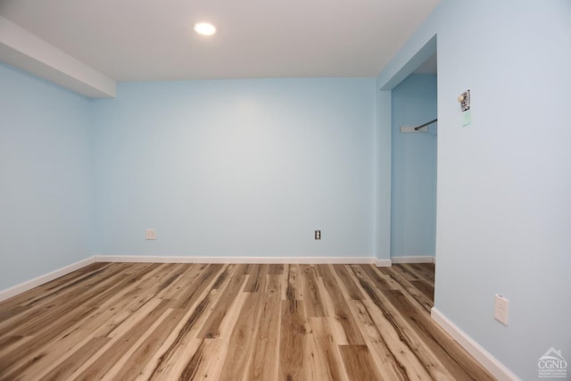 interior space with recessed lighting, baseboards, and wood finished floors