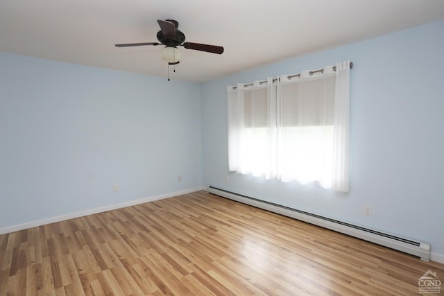 unfurnished room with light wood finished floors, baseboards, baseboard heating, and a ceiling fan