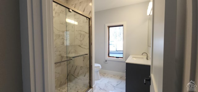 bathroom featuring vanity, toilet, and walk in shower