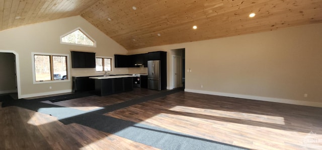 kitchen with high vaulted ceiling, wooden ceiling, a center island, dark hardwood / wood-style floors, and stainless steel refrigerator