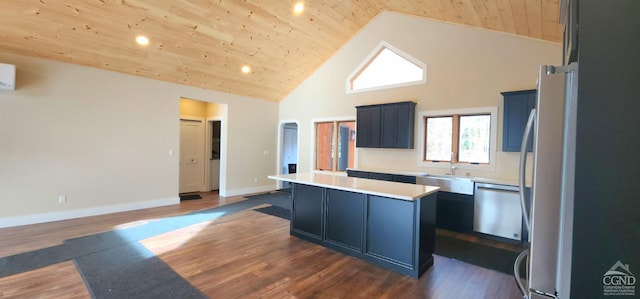 kitchen with stainless steel dishwasher, a kitchen island, refrigerator, and wood ceiling