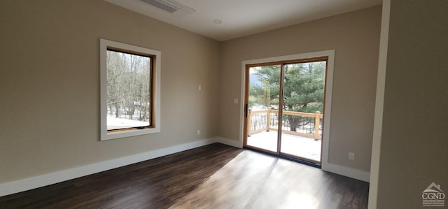 unfurnished room featuring dark hardwood / wood-style flooring