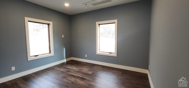 empty room with dark wood-type flooring