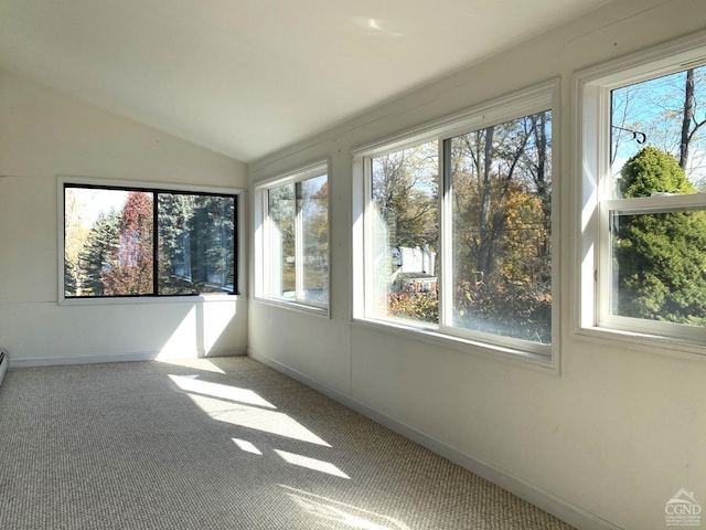 unfurnished sunroom featuring plenty of natural light and vaulted ceiling