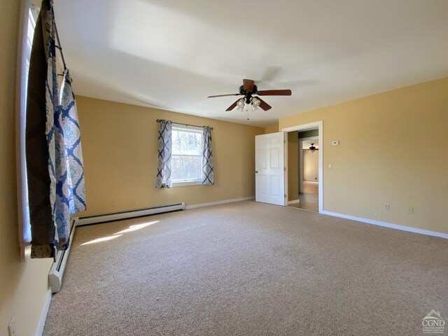 unfurnished bedroom with ceiling fan, carpet floors, and baseboard heating