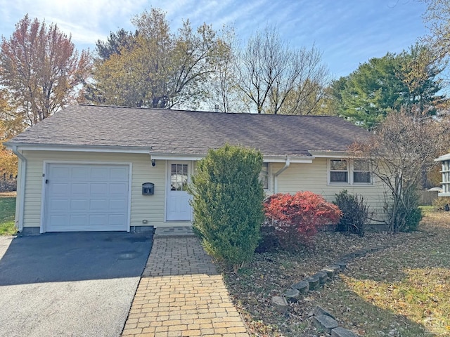 single story home with a garage