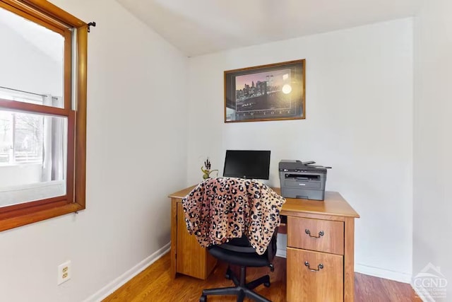 office with baseboards and wood finished floors