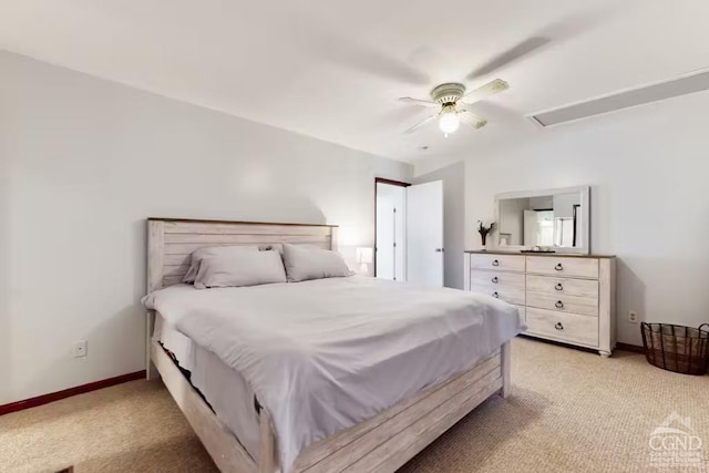 bedroom with baseboards, light colored carpet, and a ceiling fan