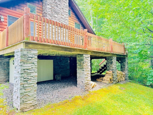 view of side of home with a wooden deck