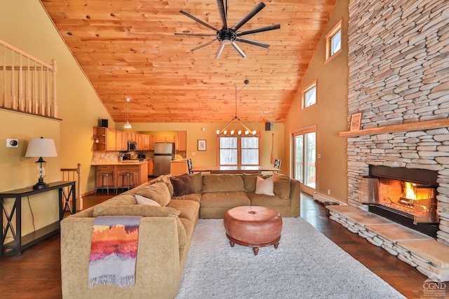 living room featuring high vaulted ceiling, wooden ceiling, dark hardwood / wood-style floors, and a fireplace