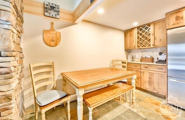 dining room featuring beamed ceiling