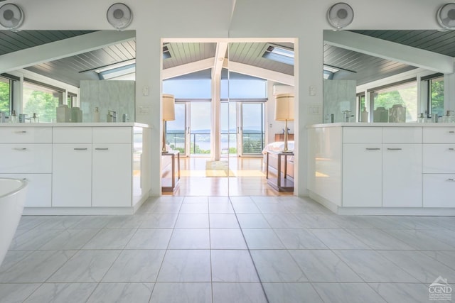 bathroom featuring vaulted ceiling with beams and wooden ceiling