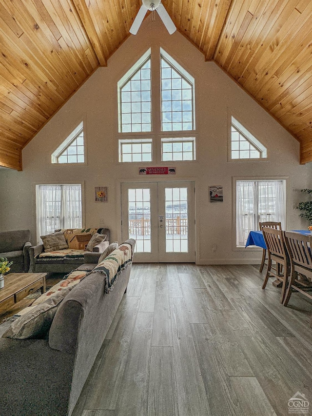 living room featuring hardwood / wood-style floors, wood ceiling, and a wealth of natural light