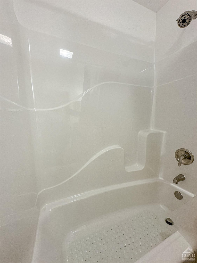 bathroom with shower / tub combination