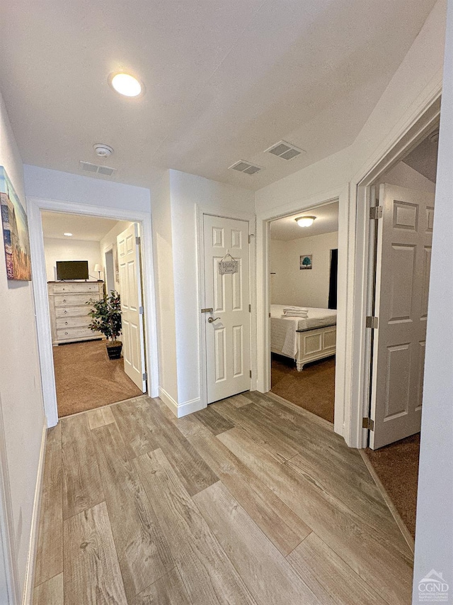 hallway with light wood-type flooring