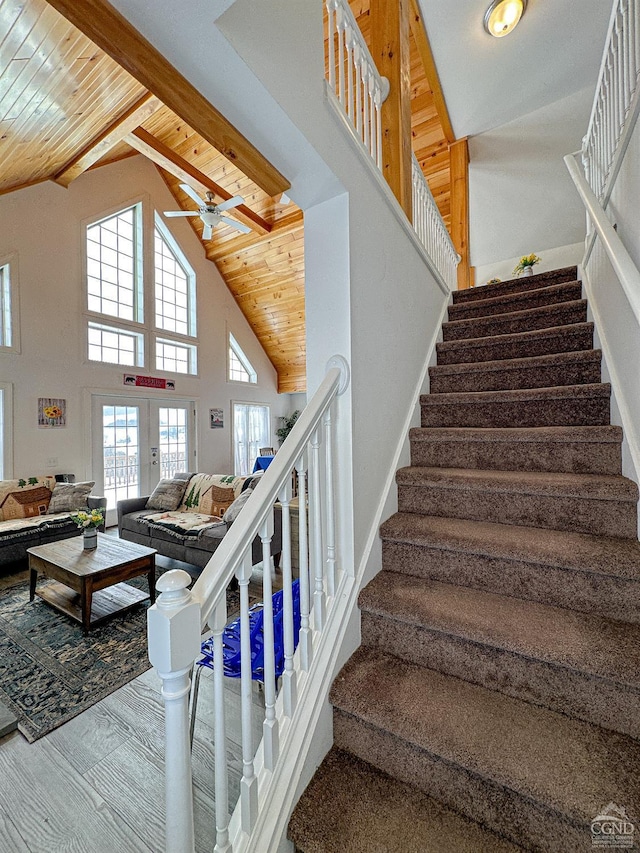 staircase featuring hardwood / wood-style floors, french doors, high vaulted ceiling, and wood ceiling