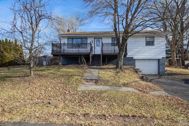 view of front of property featuring a deck and a garage