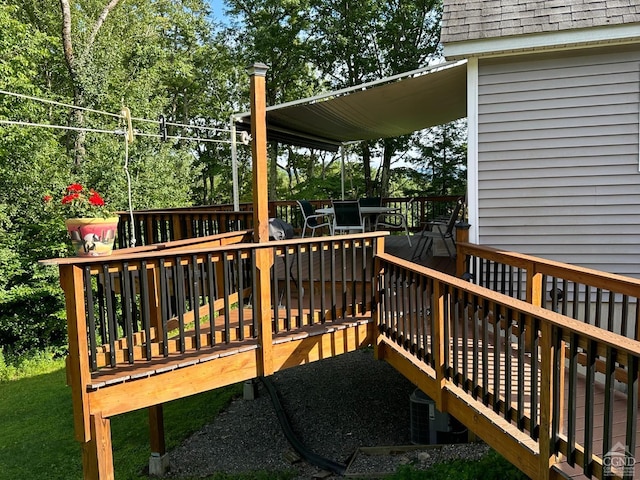 wooden terrace featuring central AC unit