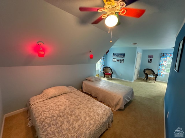 bedroom featuring carpet, ceiling fan, lofted ceiling, and multiple windows