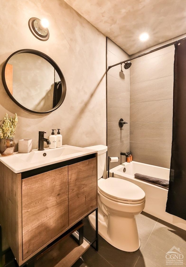 full bathroom with tile patterned floors, vanity, toilet, and shower / bath combo with shower curtain