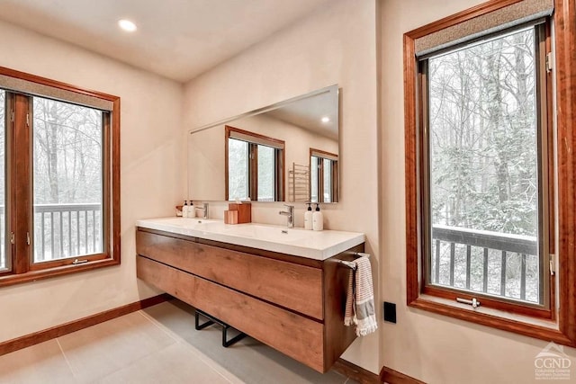 bathroom featuring tile patterned flooring and vanity