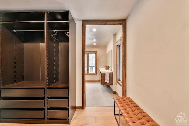 walk in closet featuring light hardwood / wood-style floors