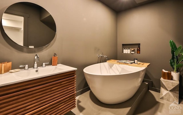 bathroom with tile patterned floors and vanity