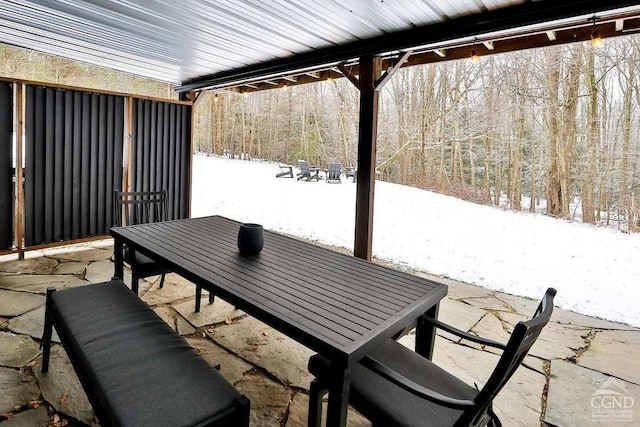 view of snow covered patio