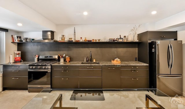 kitchen featuring wall chimney exhaust hood, stone countertops, sink, and appliances with stainless steel finishes