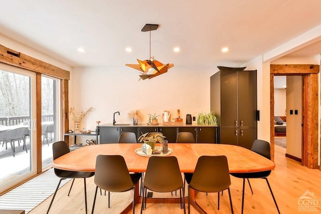 dining space featuring light wood-type flooring