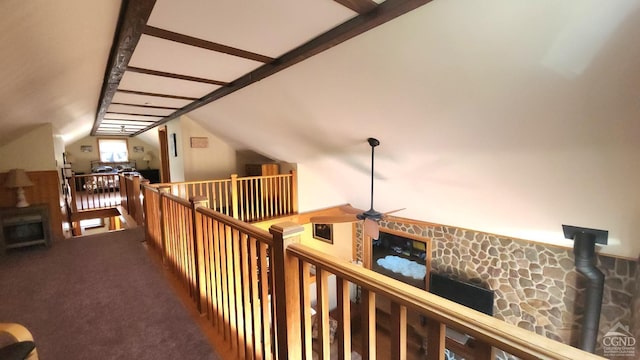 hallway featuring carpet flooring and lofted ceiling with beams